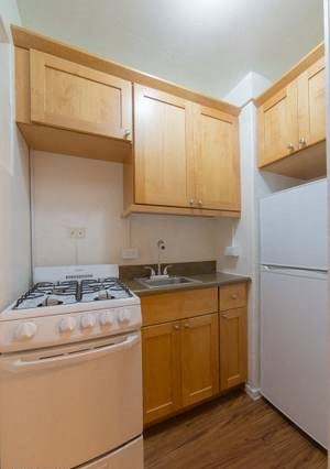 Moana Vista Apartments kitchen area with appliances, cabinets, and counters 