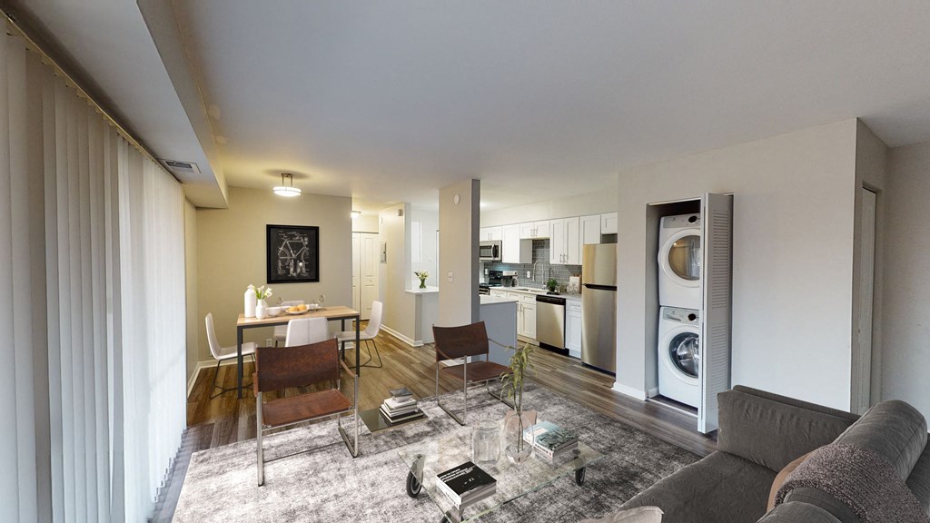 a living room with a couch and a table with chairs