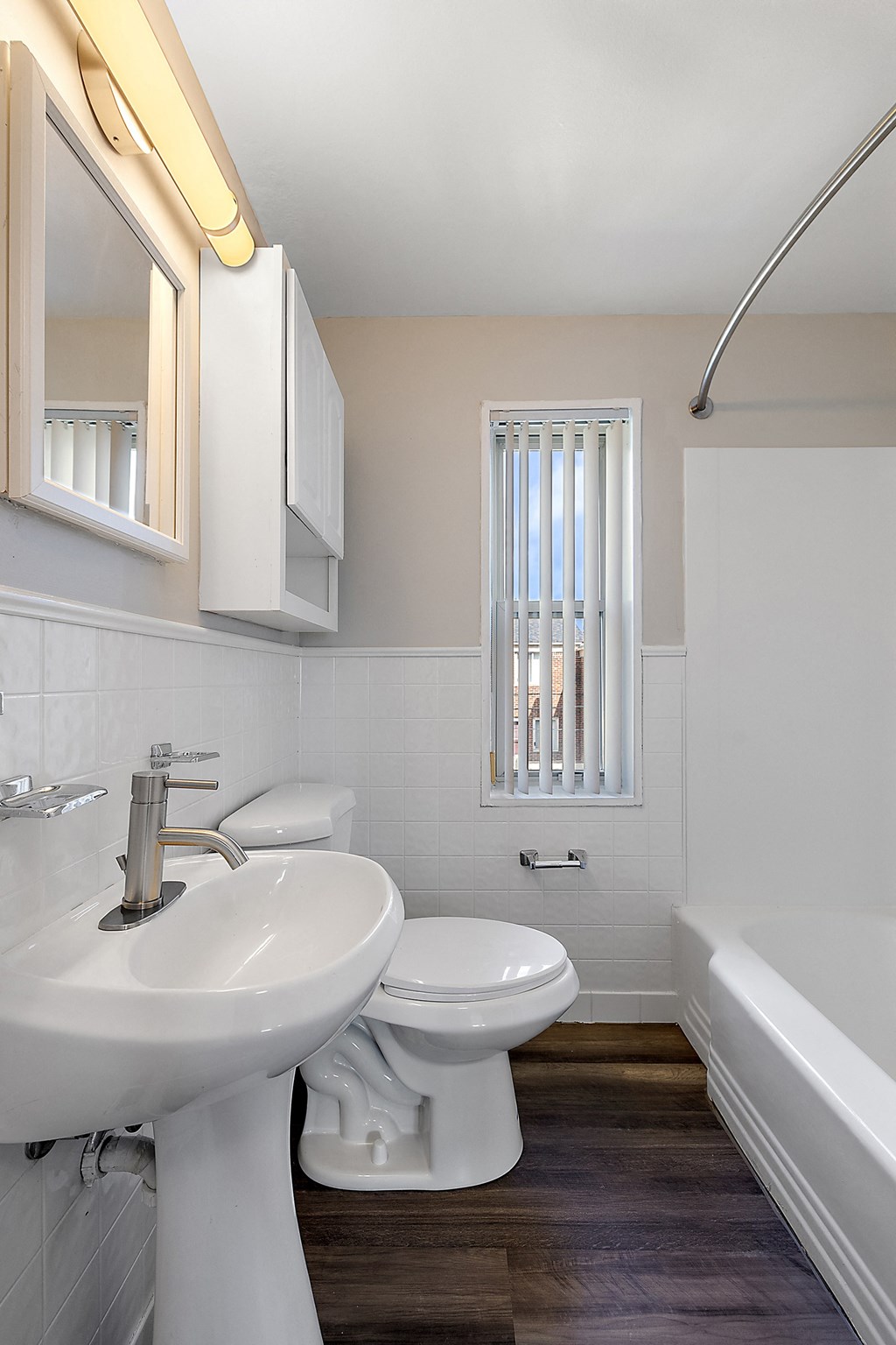 a bathroom with a sink toilet and bathtub