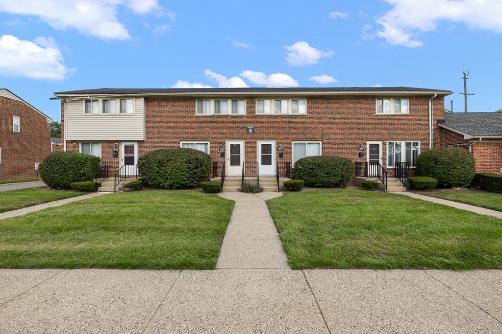 a house with a walkway in front of it