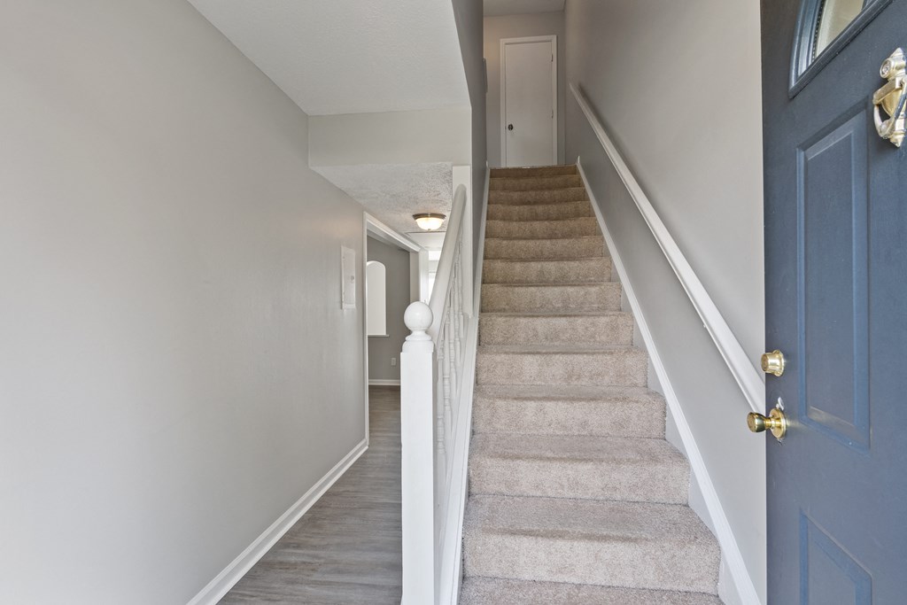 a view from the bottom of the stairs in a 555 waverly unit