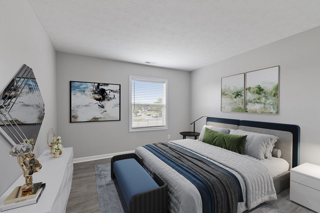 a bedroom with a bed and a chair in a 555 waverly unit