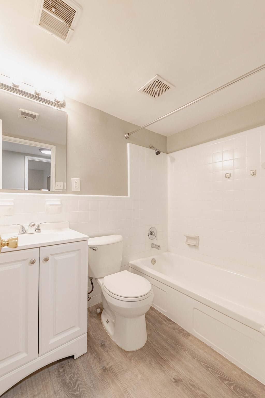 a bathroom with a toilet sink and bathtub