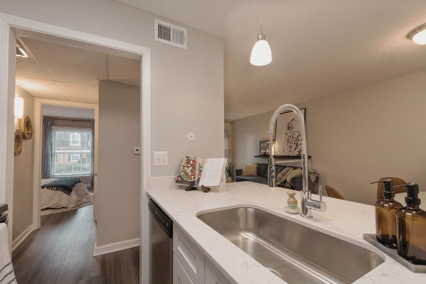 a kitchen with a sink and a dishwasher in a 555 waverly unit - Photo Gallery