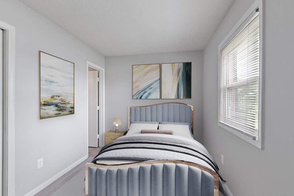 a bedroom with a bed and two windows