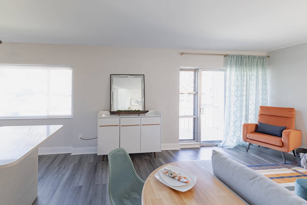 a living room with a couch and a chair and a table