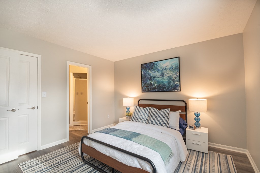 a bedroom with a bed and two night stands