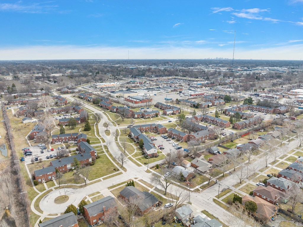 an aerial view of a neighborhood with houses and trees