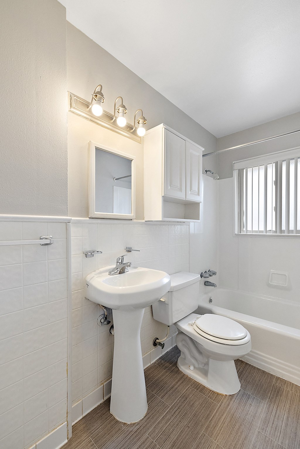 a bathroom with a sink toilet and bathtub