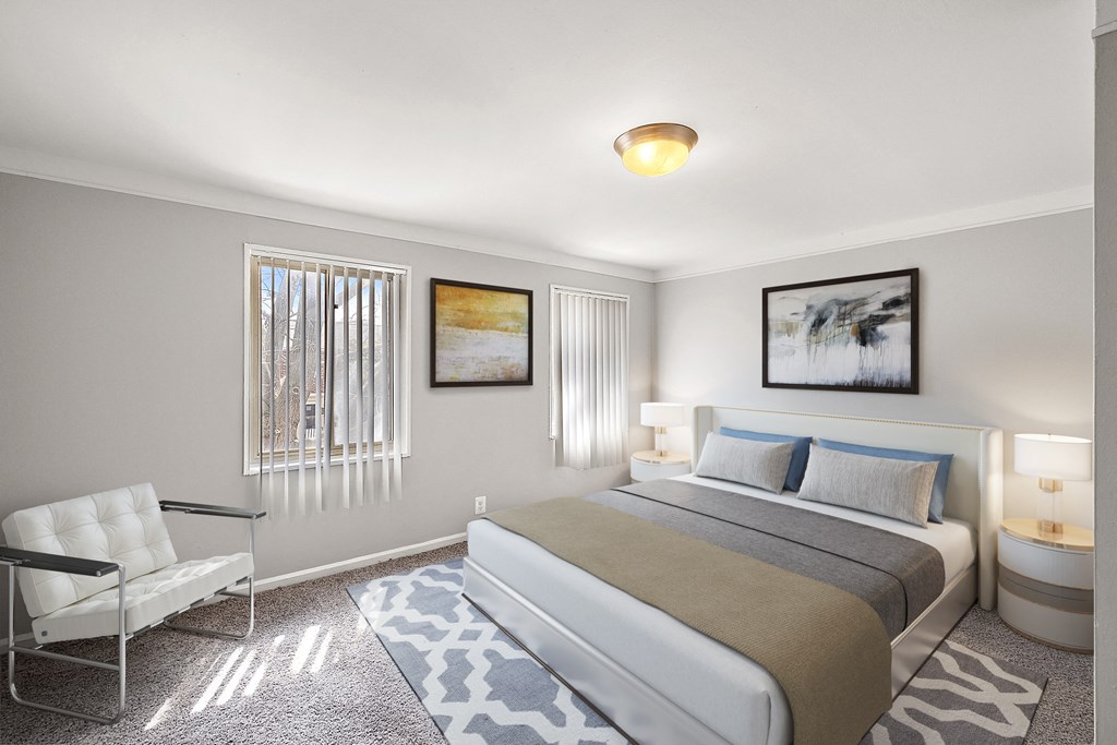 a bedroom with a bed and a chair