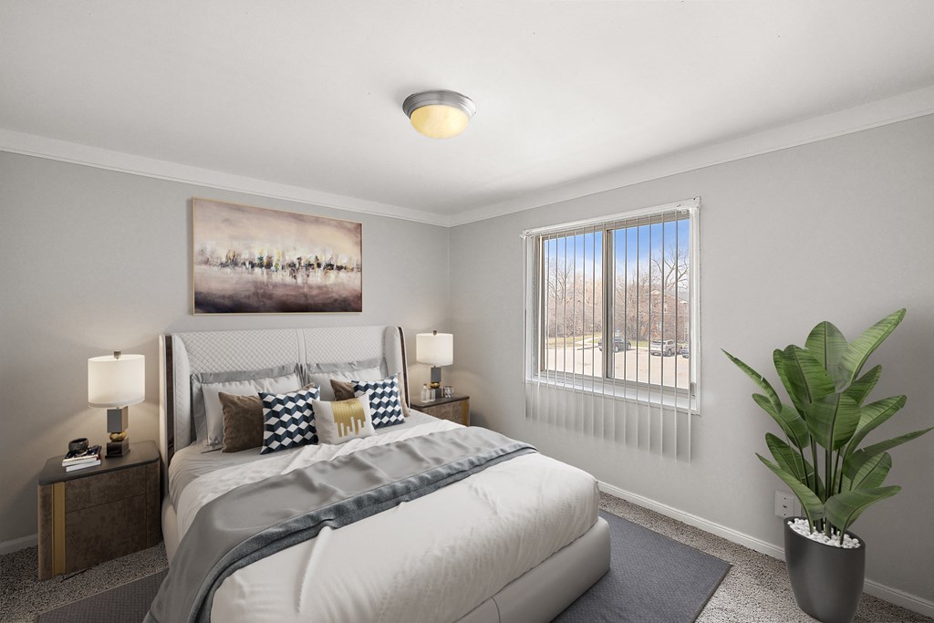 a bedroom with a large bed and a window