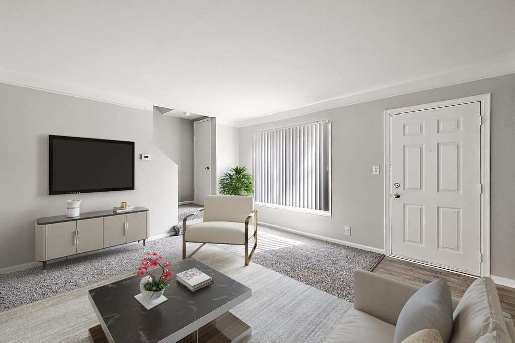 a living room with grey walls and a white door