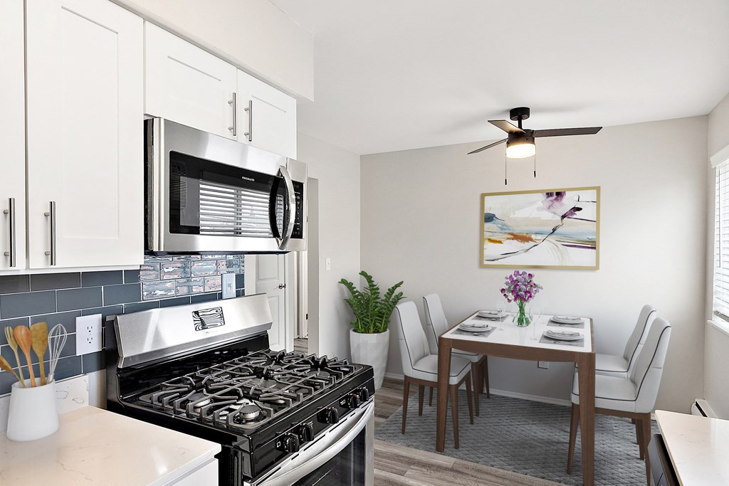 a kitchen and dining area in a 555 waverly unit