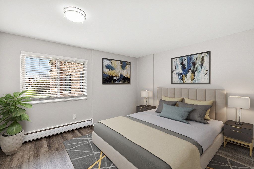 a bedroom with a large bed and a large window