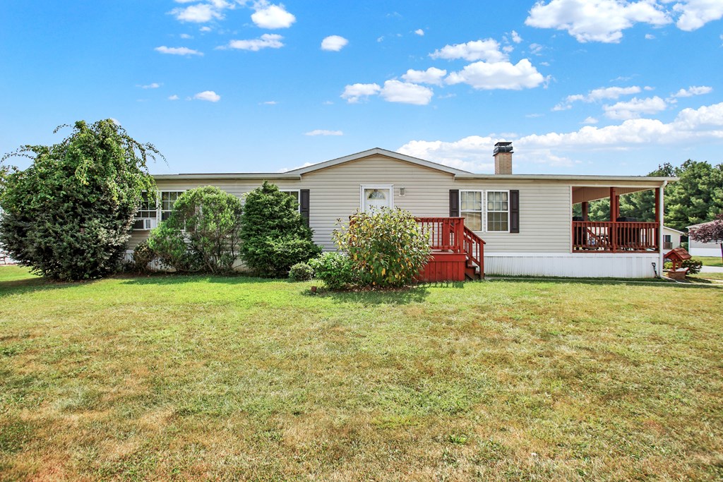 a home with a red porch