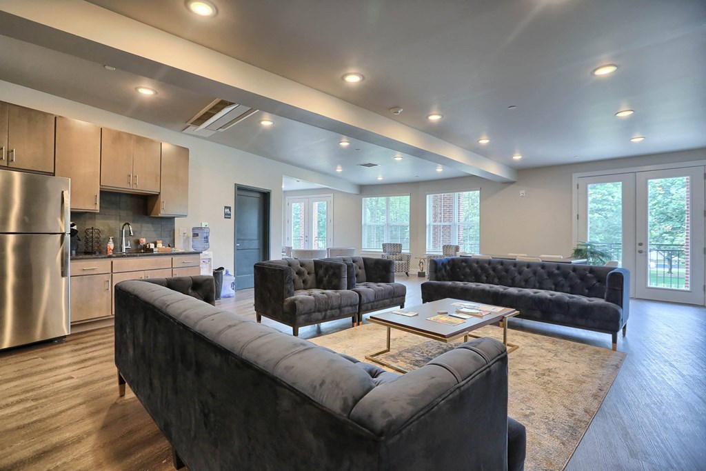 a large living room with couches and a table