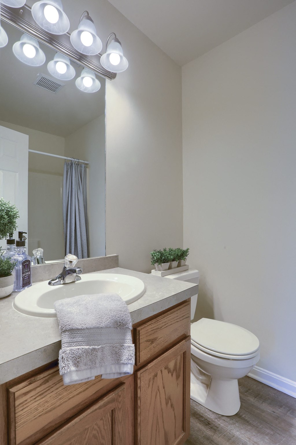 Mechanicsburg Apartments | Rockledge Townhomes |half bathroom with a toilet sink and mirror