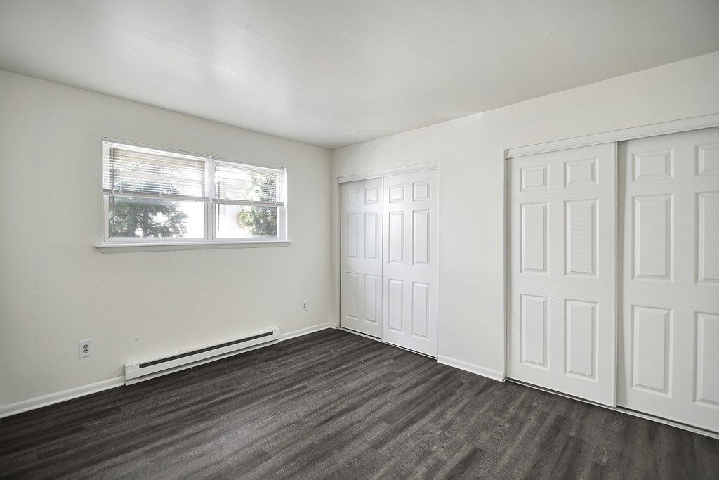 A room with a window and a door.