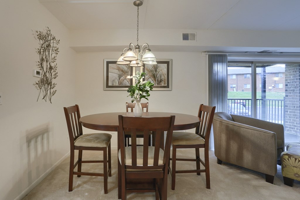 Apartments in Harrisburg | Twin Lakes Apartments | a dining room with a table and chairs