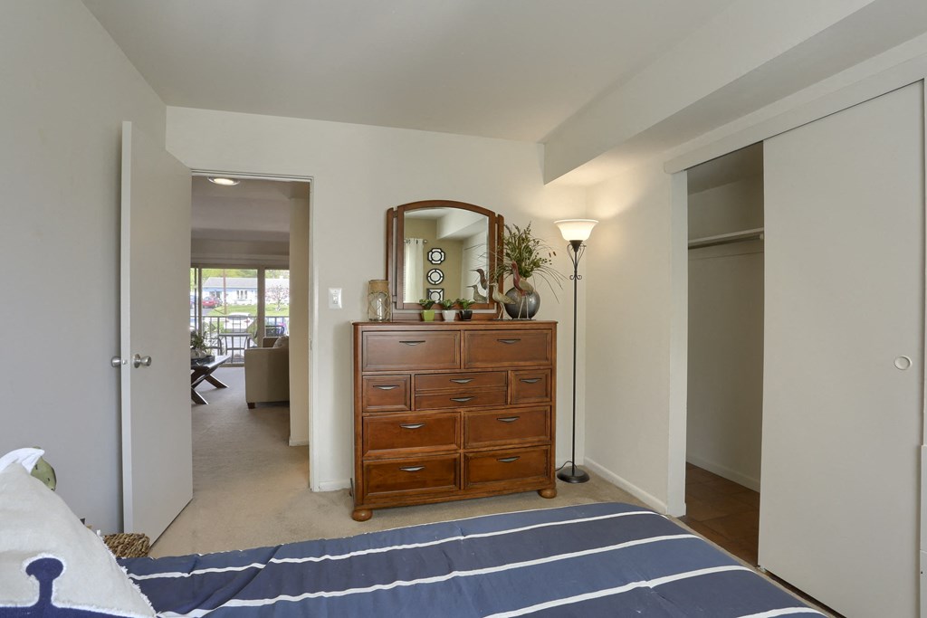 Harrisburg Apartment | Twin Lakes Apartments | a bedroom with a dresser with a mirror on top of it