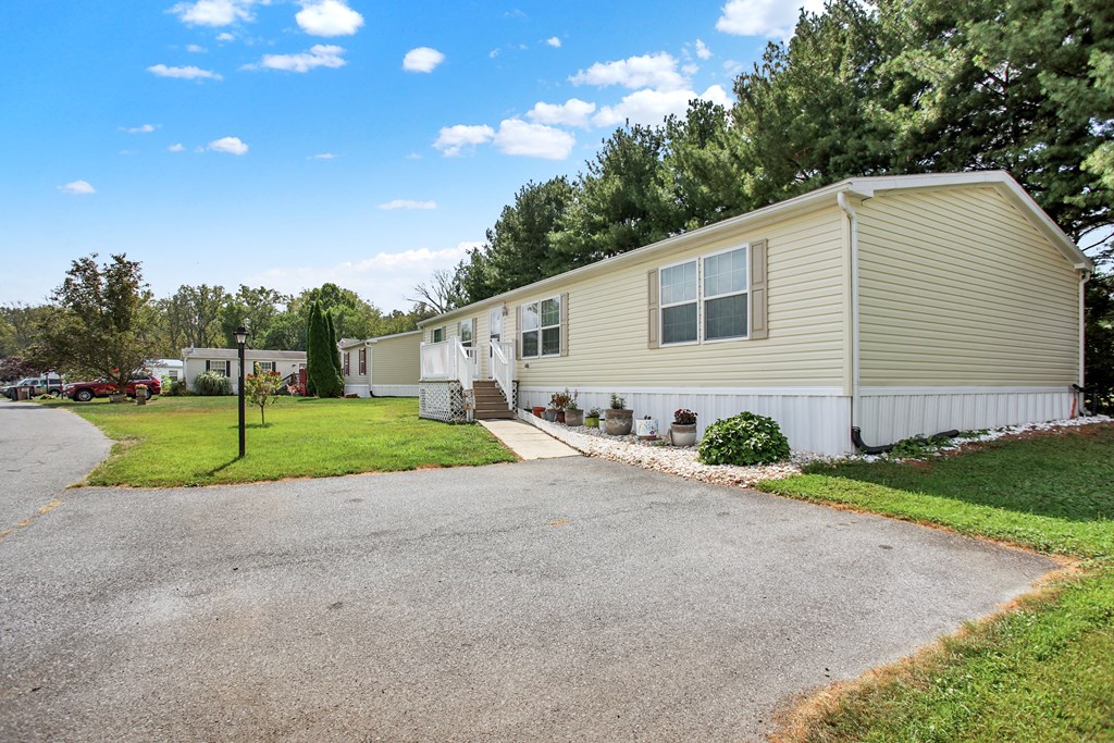 a home with a driveway in front of it