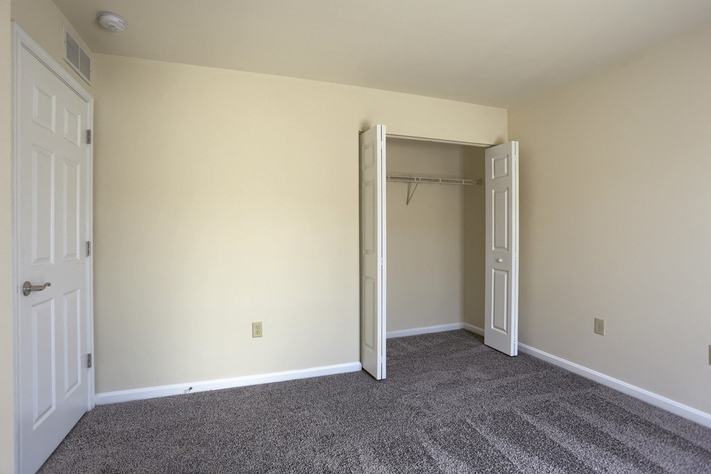 Mechanicsburg Apartments | Rockledge Townhomes | a bedroom with a closet and carpeted floor