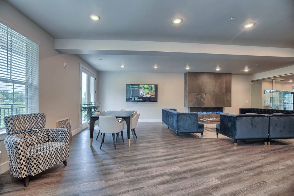 a living room with a table and chairs and a couch