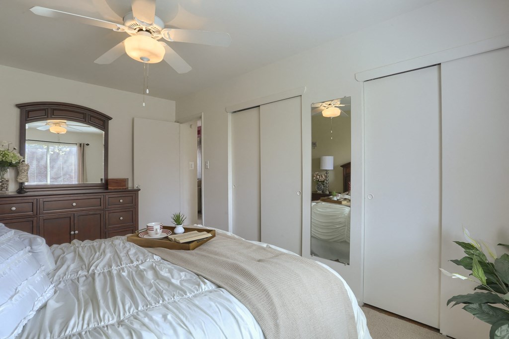 Harrisburg Apartment | Twin Lakes Apartments | a bedroom with white walls and a ceiling fan