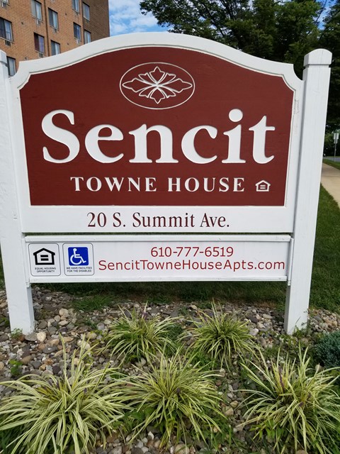 a sign in front of a toowoomba town house
