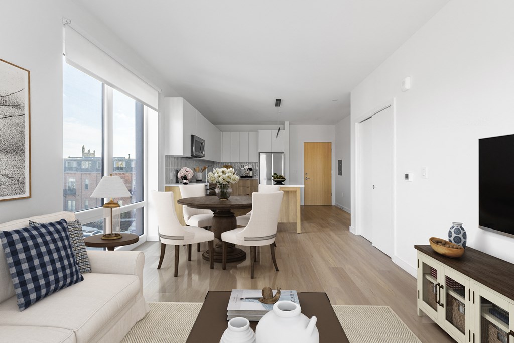 A modern living room with a dining table and chairs.