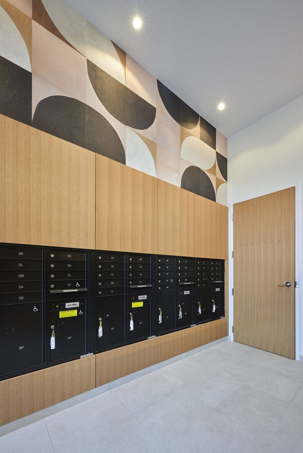 the lockers in the club room are lined up against the wall with a mural