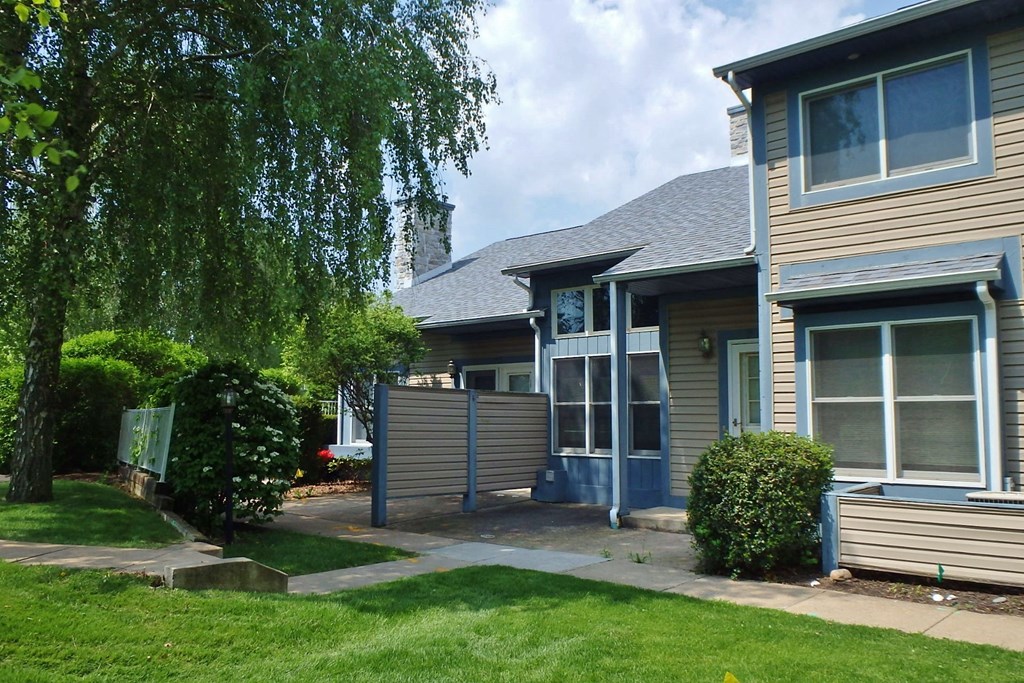 a house with a sidewalk in front of it