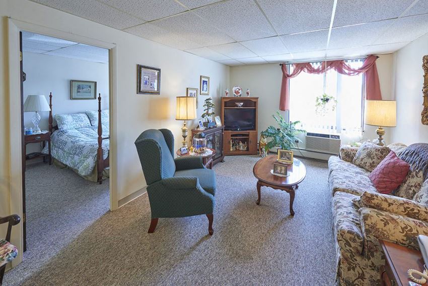 a living room with a couch and a chair