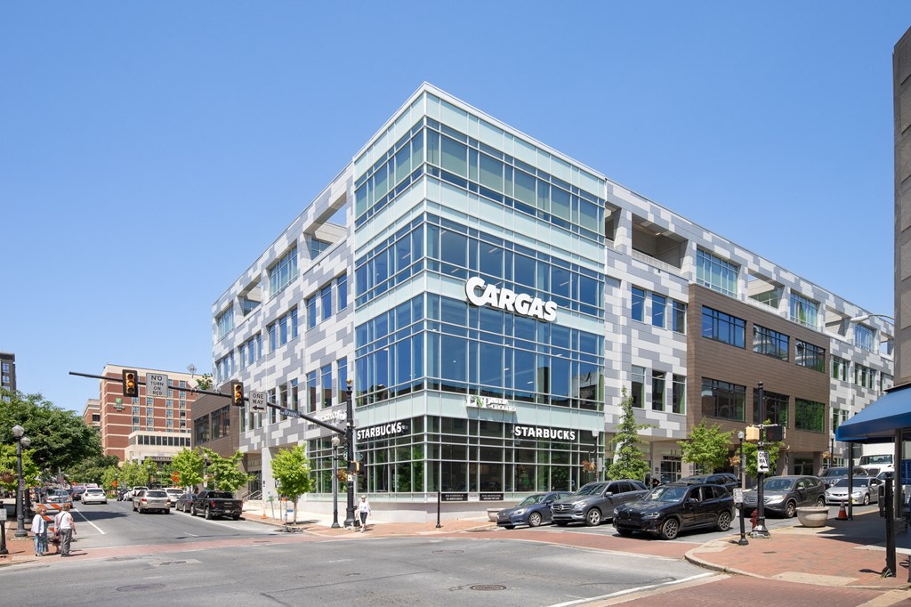 a large blue building on the corner of a city street