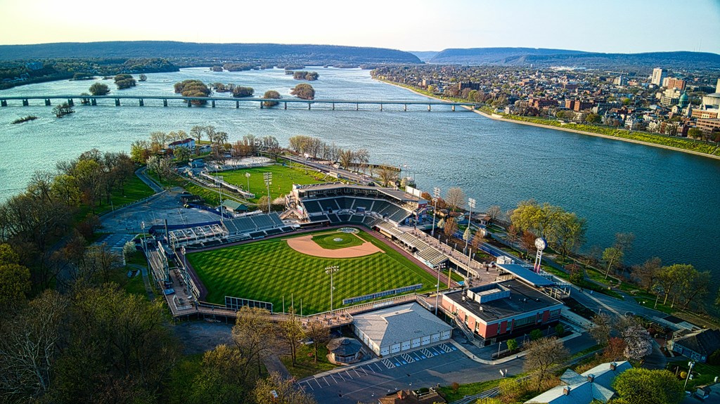 an aerial view of a baseball stadium next to a river