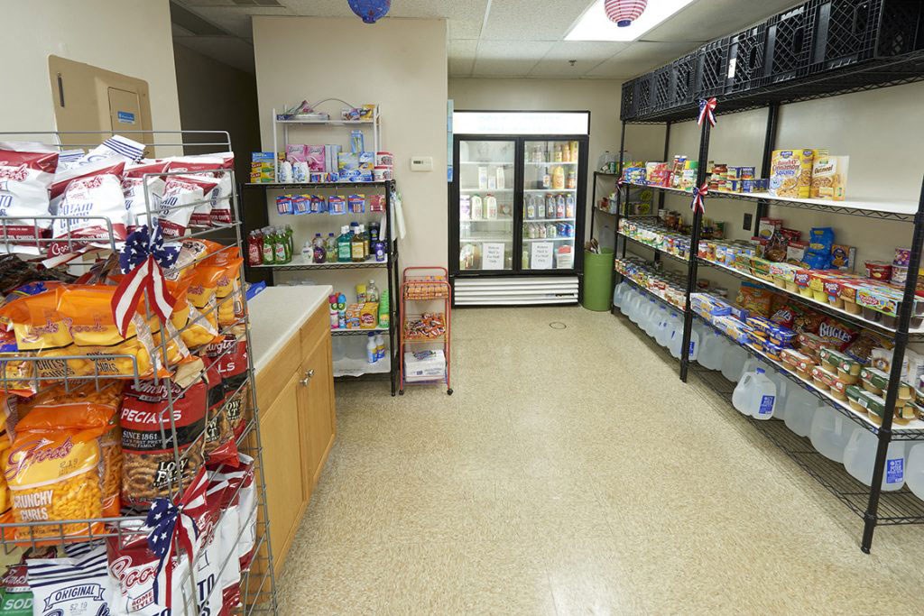 a grocery store with a long aisle filled with food