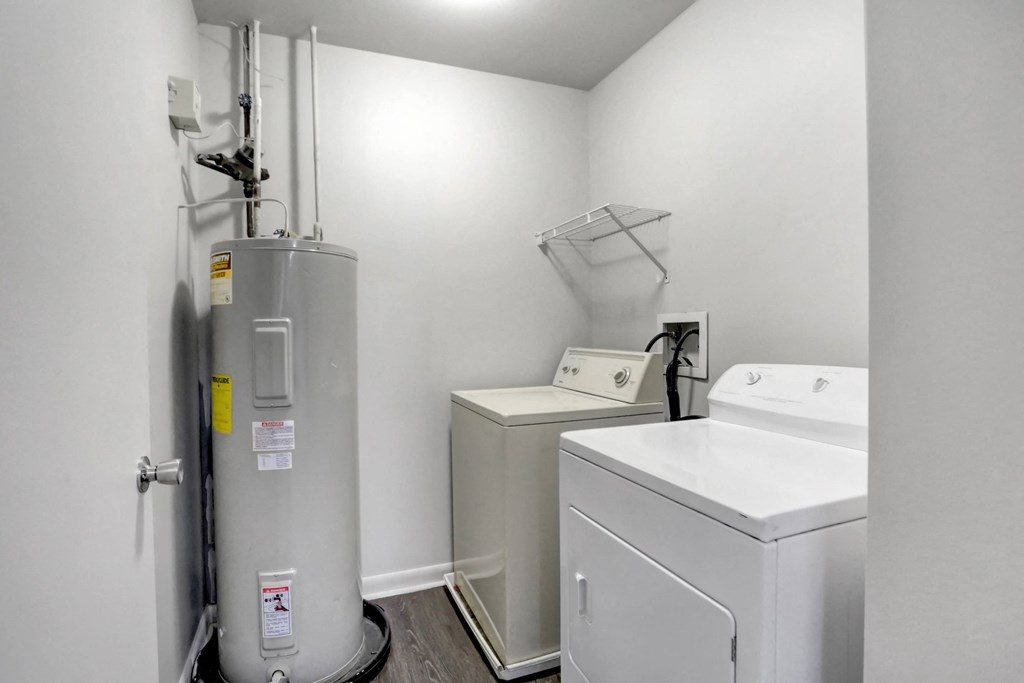 a laundry room with a washer and dryer and a washing machine