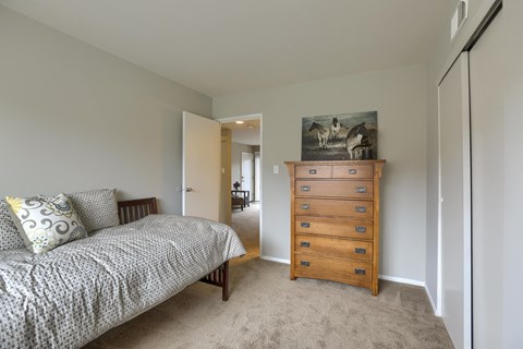 Mechanicsburg Apartments | Delbrook Manor Apartments | a bedroom with a bed and a dresser