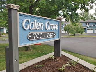 a sign for calen grove in front of a street