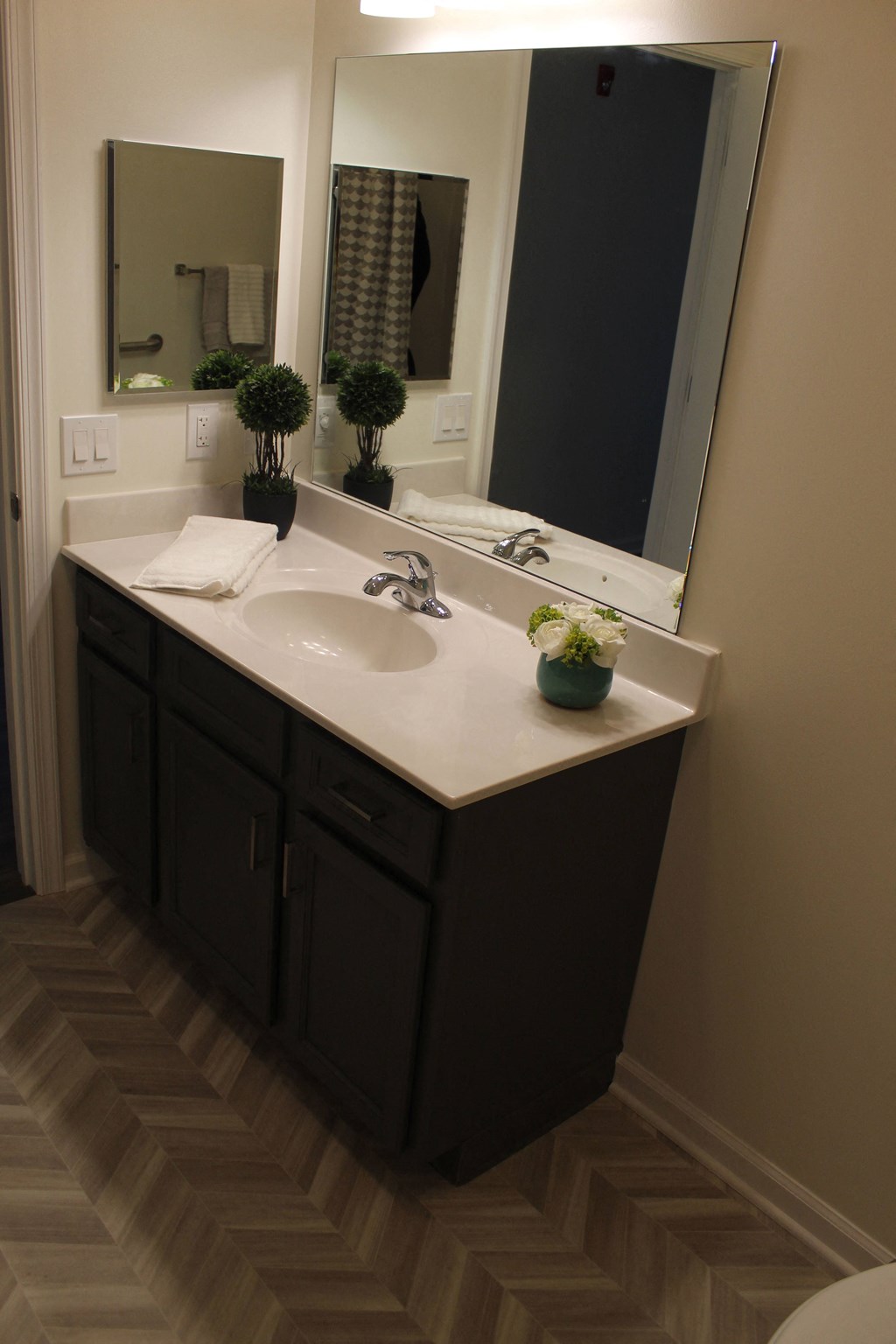 a small bathroom with a sink and a mirror