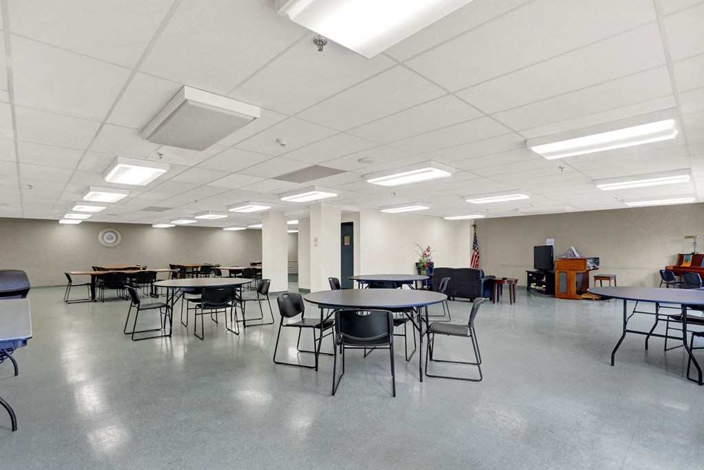 a large room with tables and chairs