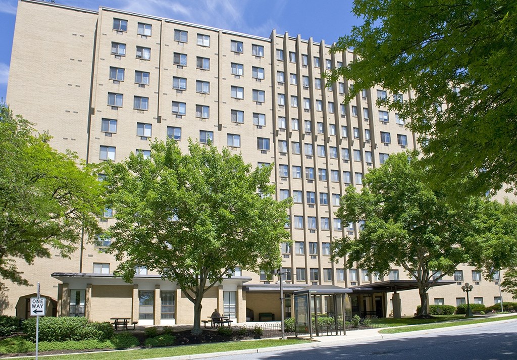 a large building with trees in front of it