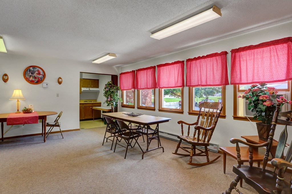 a room with a table and chairs