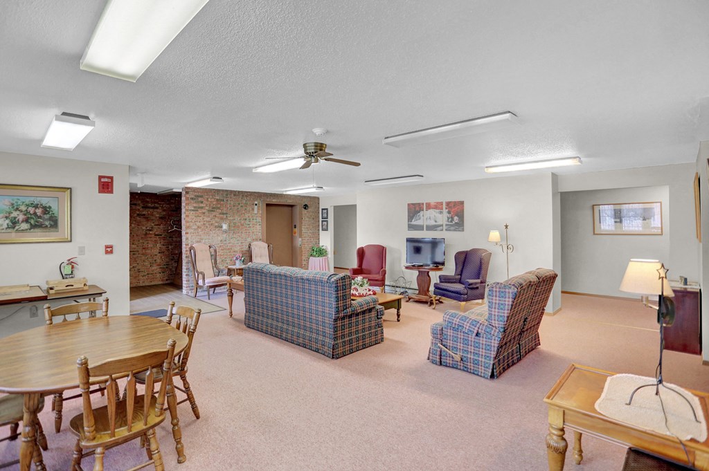 a living room with couches chairs and a table