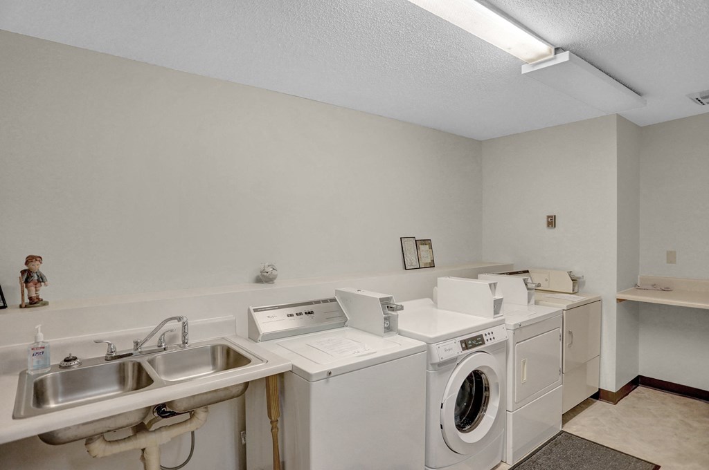a laundry room with a washer and dryer