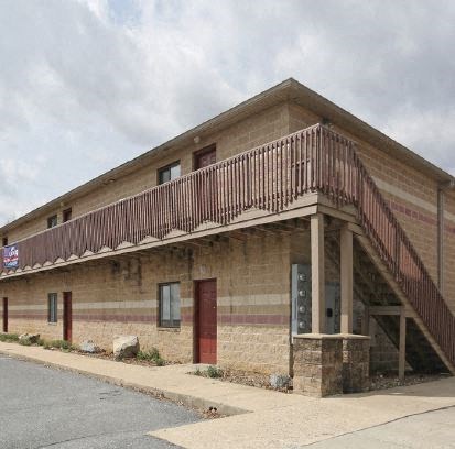 a building with a balcony on the side of it