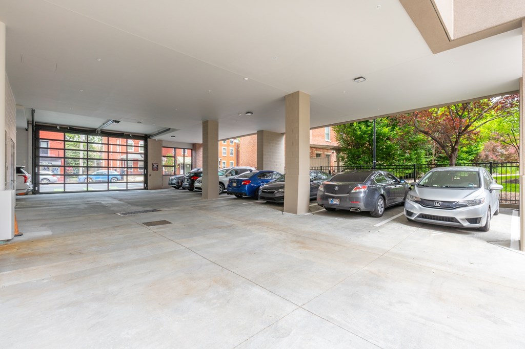 A parking garage with cars parked in it.