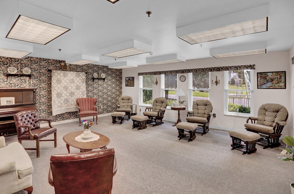 a waiting room with chairs and a piano