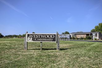 a sign for the westwood community in front of a building