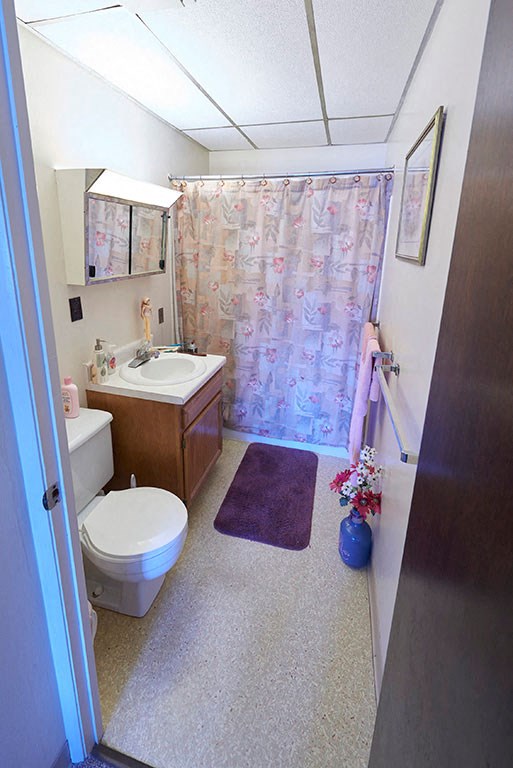 a bathroom with a toilet a sink and a shower